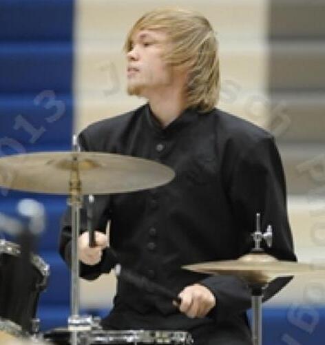 Dalton playing the drumset for Winter Percussion.